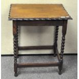 An early 20th century oak occasional table, barley twist supports,