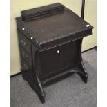 A reproduction davenport desk, with opening pen compartment to top,