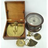 A group of six astrological items, five brass examples, including compasses, star symbols,