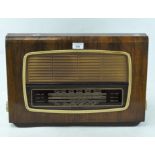 A vintage wood veneer cased "Regentone" radio,