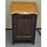 A mahogany single door pot cupboard, opening to reveal two shelves,