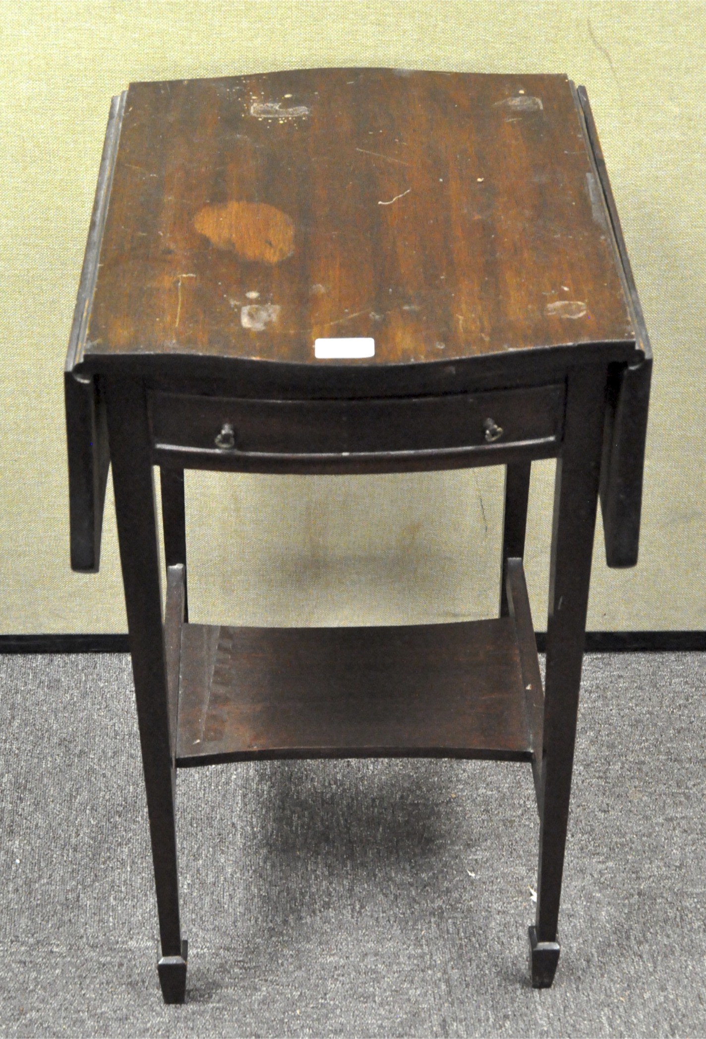 A mahogany drop leaf occasional table with drawer to one side,