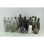 A selection of vintage glass bottles, to include lemonade bottles from Bristol, green ovoid bottle,