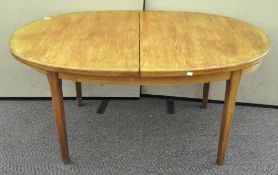 An oval extending dining table,