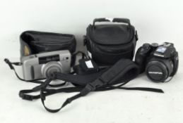 An Olympus SP-570UZ camera and Canon Z135 camera with cases (2)