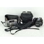 An Olympus SP-570UZ camera and Canon Z135 camera with cases (2)