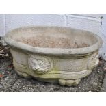 A Cotswold range planter with lion decoration,