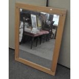A modern oak wall mirror,