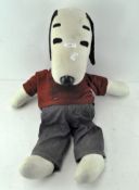 A vintage 1950's soft Snoopy toy, wearing original "the gangs all here" shirt,