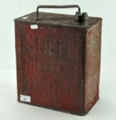 A vintage red painted Shell Motor Spirit fuel can,