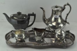 A collection of silver plate to include a tray and coffee pots