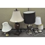 A group of five modern table lamps, including one from Ikea,