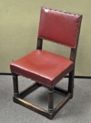 A heavy oak upholstered chair, with turned supports,