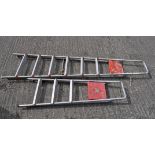 Two sets of folding aluminium ladders