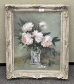 An oil on canvas depicting a floral still life, flowers in a vase, framed,