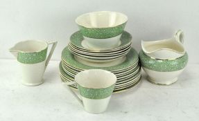 A Wedgwood & Co dinner service in the 'Garden' pattern, comprising cups, saucers, two jugs,