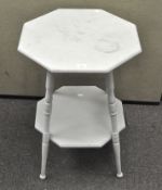An octagonal wooden top side table, with turned supports and an undertier, height 71cm,