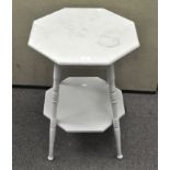 An octagonal wooden top side table, with turned supports and an undertier, height 71cm,