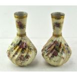 A pair of Royal Worcester blush ivory vases, with conical necks and wrythen body,