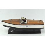 A scratch built model speedboat, wood with small metal fittings,