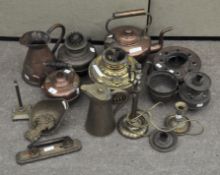 A collection of assorted brassware, including kettles,