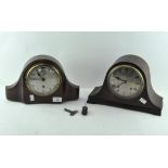 Two mantle clocks, one oak cased, the dial with Roman numerals denoting hours,