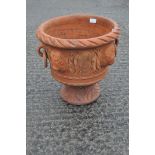 A alrge stone planter with lion decoration