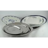 A quantity of serving trays and platters, including ceramic meat plates, metal trays etc,