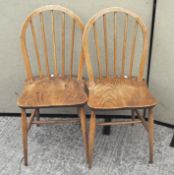 A pair of vintage Ercol hoop and stick back dining chairs