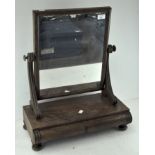 A Victorian mahogany swing mirror