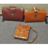 Two leather briefcases, and a shoulder bag,