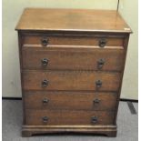 An oak chest of five graduated long drawers with metal pull ring handles,