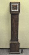 An oak cased Grandmother clock, on square base,