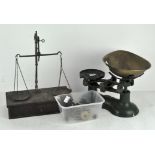 A set of vintage Thomas Plant kitchen scales in green with brass weights and tray;