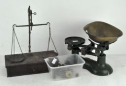 A set of vintage Thomas Plant kitchen scales in green with brass weights and tray;