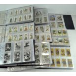 An extensive collection of cigarette cards, including sets by Wills, Players,