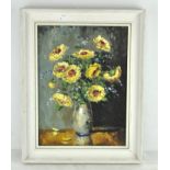A 20th century oil on canvas depicting flowers in a vase, unsigned,