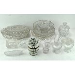 A collection of assorted cut and moulded glassware, including bowls, trays, cups and more,