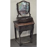 A 19th century toilet mirror on a mahogany base with three drawers below