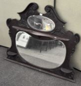 A large Victorian overmantle mahogany mirror, with three shelves,