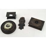 A box of Black Forest carvings, including a brass framed barometer on a carved wooden mount,