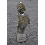 A stone figure of a girl,