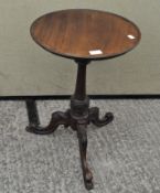 A mahogany wine table on tripod base,