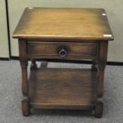 A modern side table of square form, with single drawer to front,