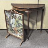 A demi-lune hall table, 73cm x 75cm x 38cm; together with an oak framed tapestry fire screen