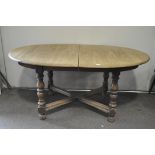 A vintage Ercol style extendable oval dining table,