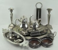 A large selection of silver plate, including a pair of candlesticks, ladies purse, platter,