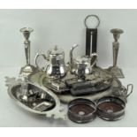 A large selection of silver plate, including a pair of candlesticks, ladies purse, platter,