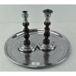 Two candle sticks togther with a tray