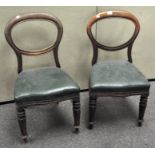 Two Victorian mahogany balloon back dining chairs